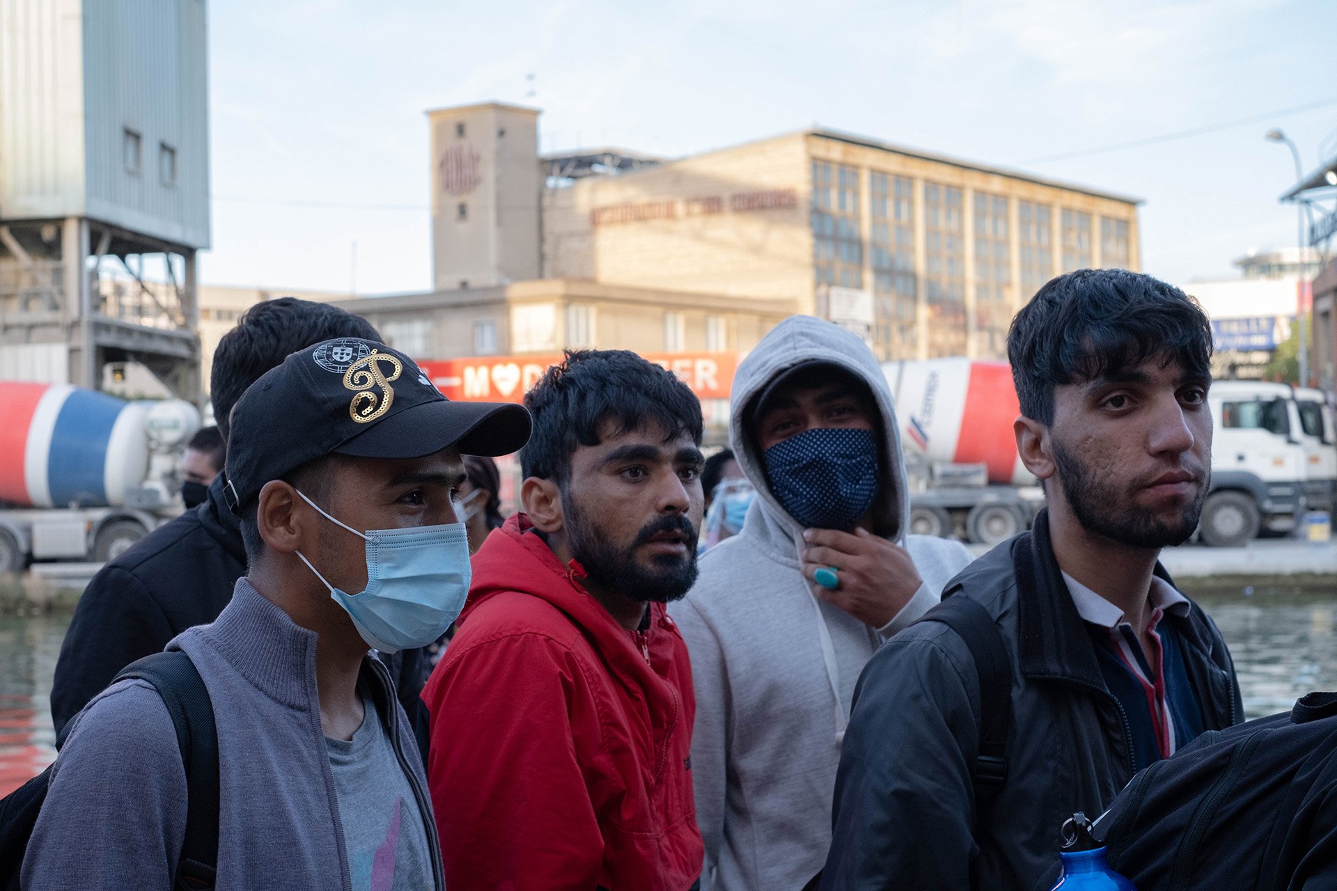 Afghan asylum seekers during an eviction from a makeshift camp on a canal in Aubervilliers, near Paris, in July 2020.