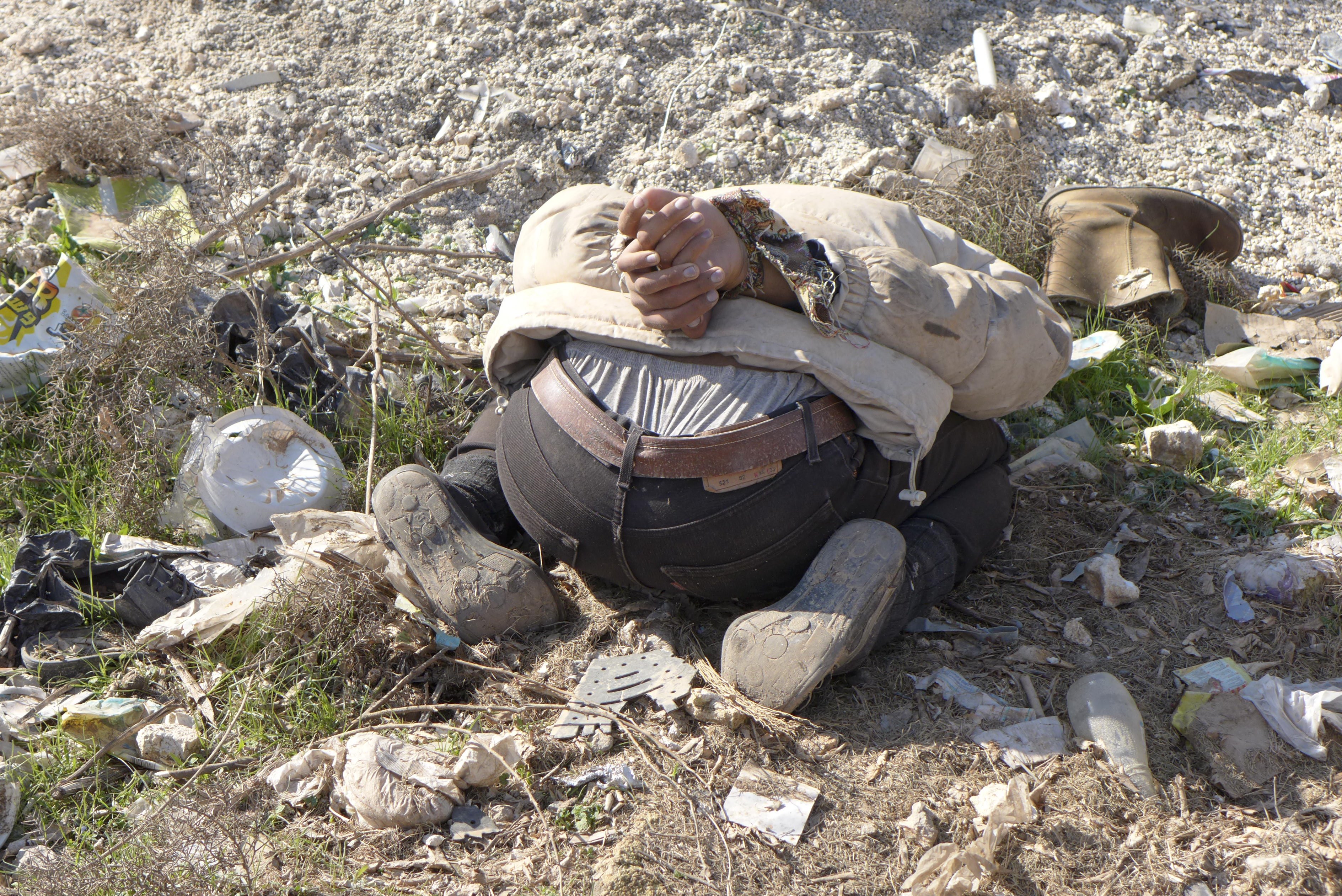 corpse with hands tied behind back