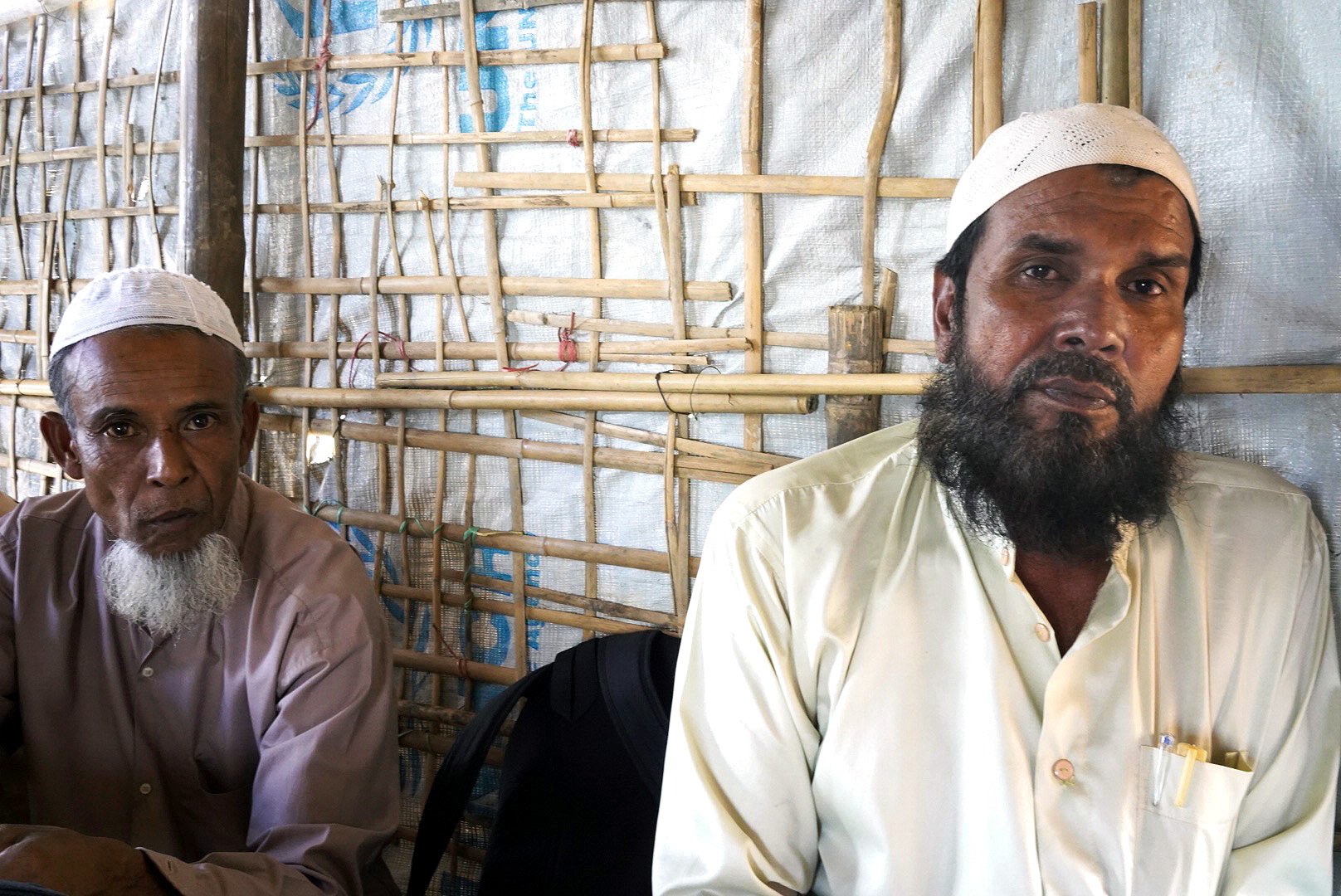 Abdul Gafoor, right, sits with neighbours in a tea shop, where the main topic of discussion has been Bangladesh’s plans to move refugees to an isolated island. Some of the men came close to volunteering to go before their families intervened.