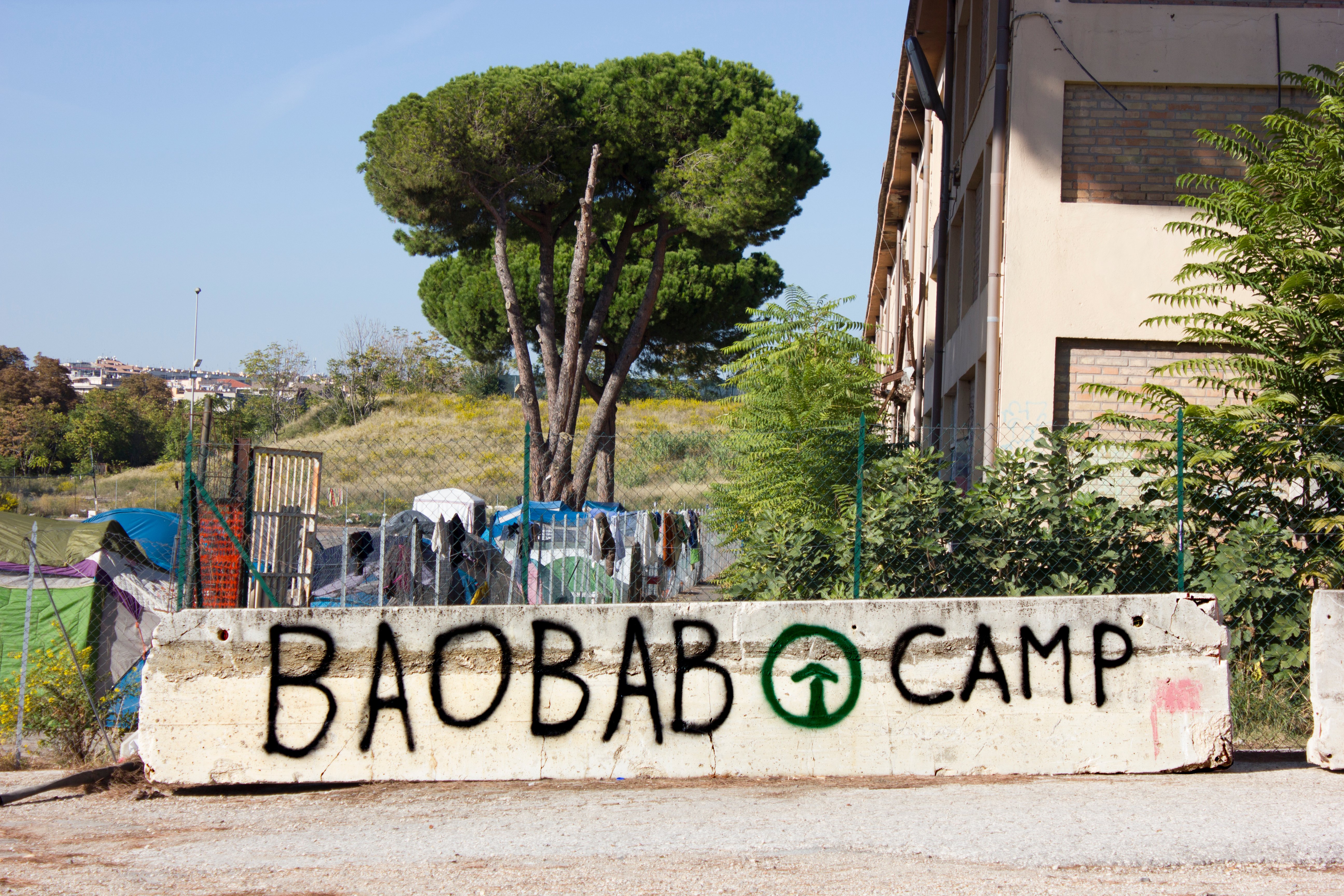 Exterior shot of a guardrail with the word Baobab painted on.