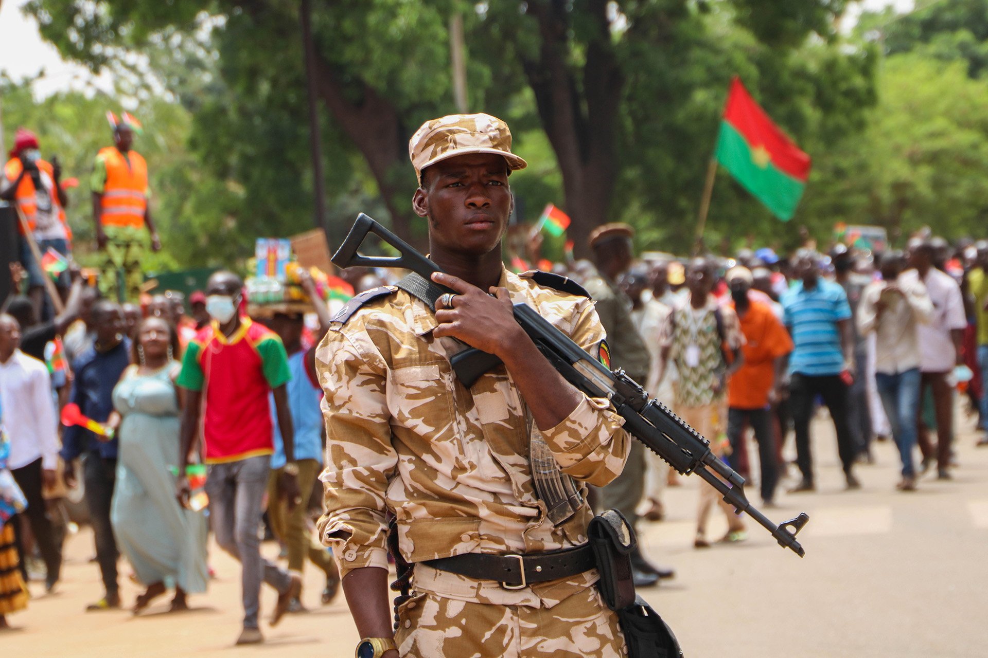 A soldier stands guard in the capital, Ouagadougou, during a protest against rising insecurity in Burkina Faso. Some 1.3 million people have been unrooted in recent years.