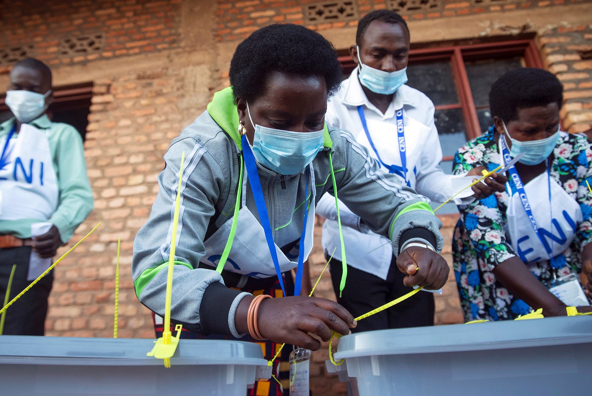 A member of Burundi’s electoral commission prepares ballot boxes at a voting station during last year’s presidential elections. Mass rallies were arranged despite the threat of COVID-19.