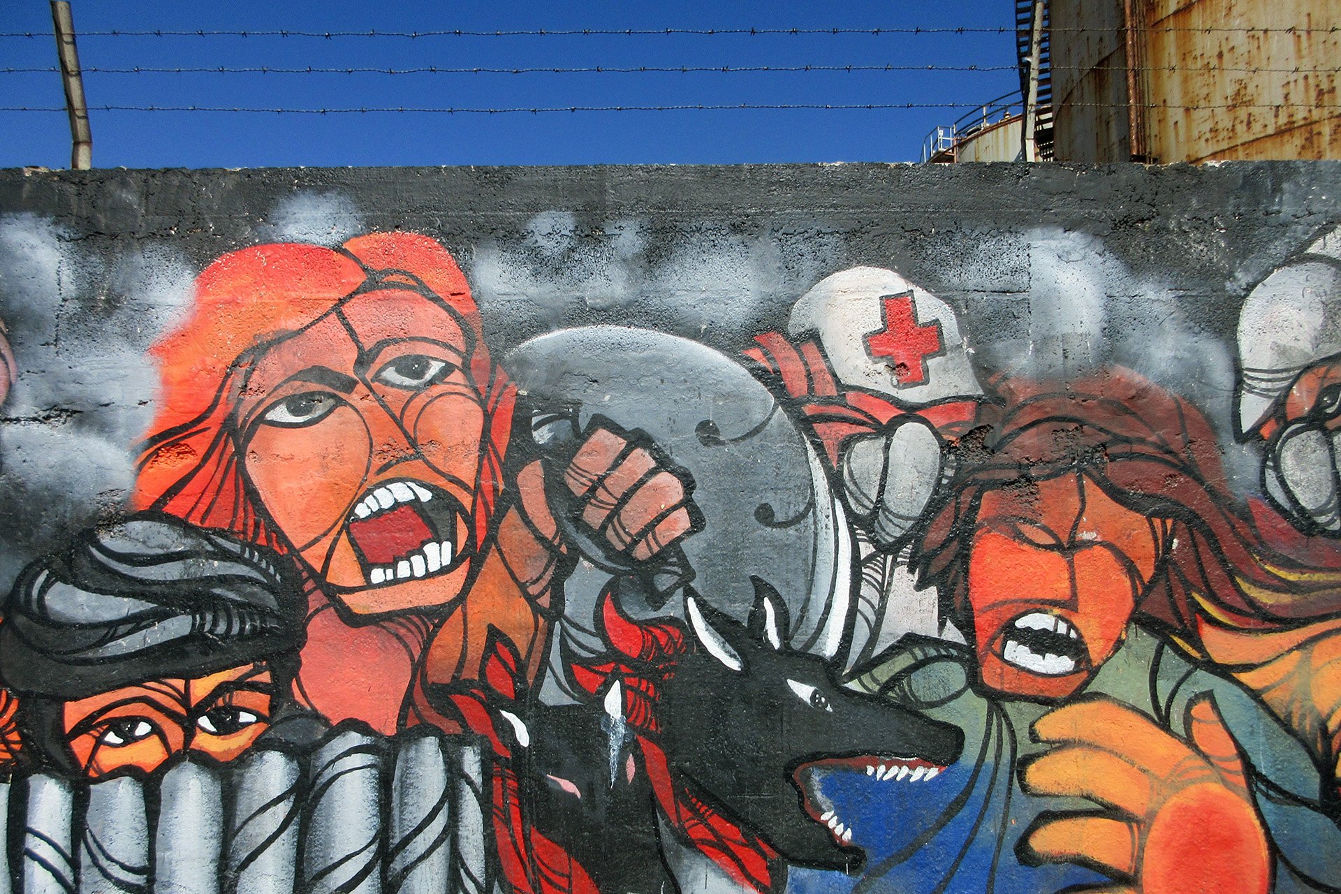 A mural in Antofagasta depicts front line demonstrators, protest medics, and a dog that has become a protest icon in Chile