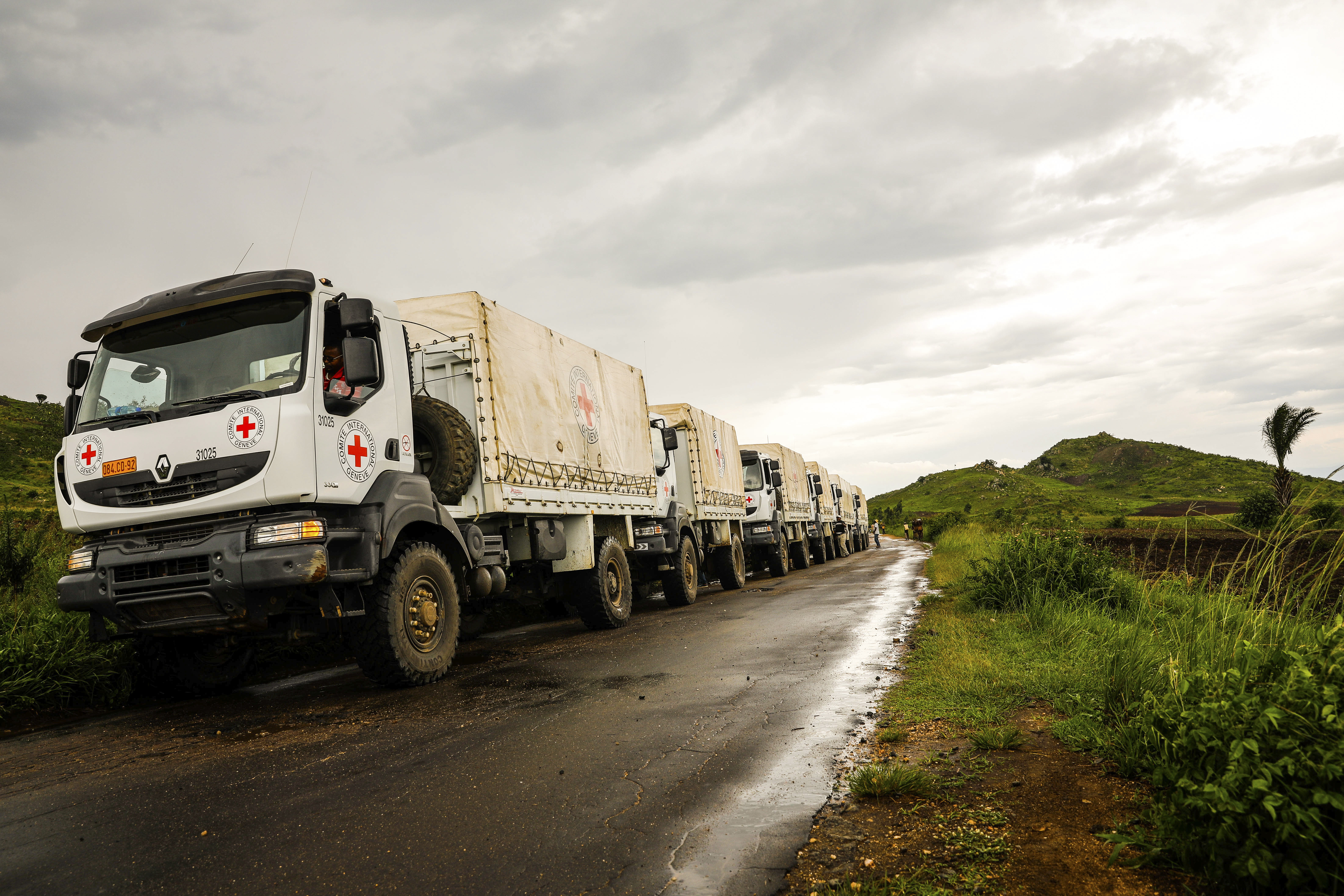 A dozen ICRC trucks deliver food and essential household items in the Democratic Republic of Congo.