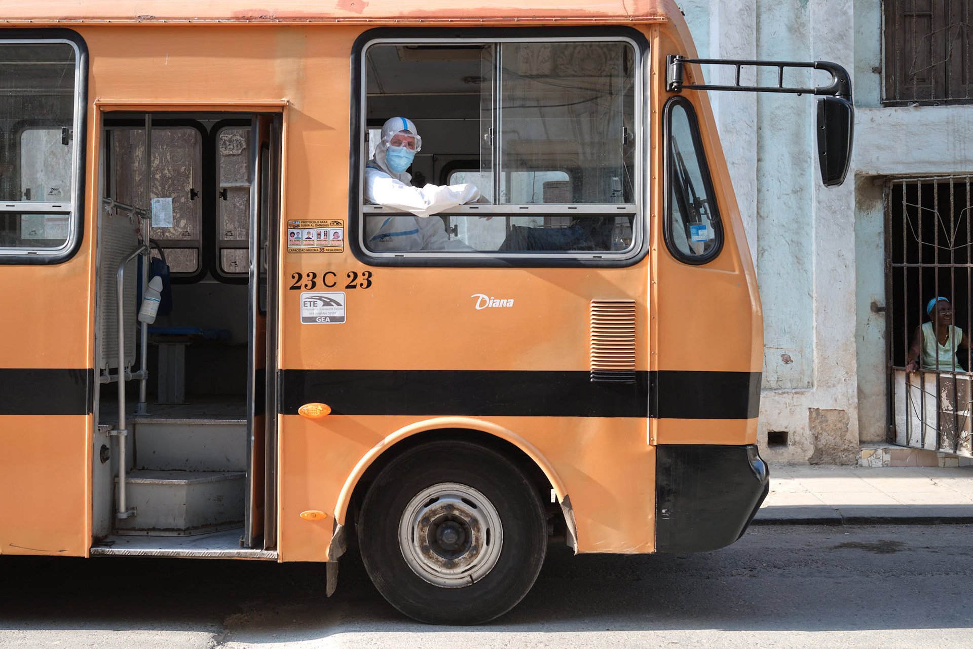 A bus used to transport COVID-19 patients parked in central Havana. After successfully containing the virus for over a year, cases in Cuba have soared in recent months.