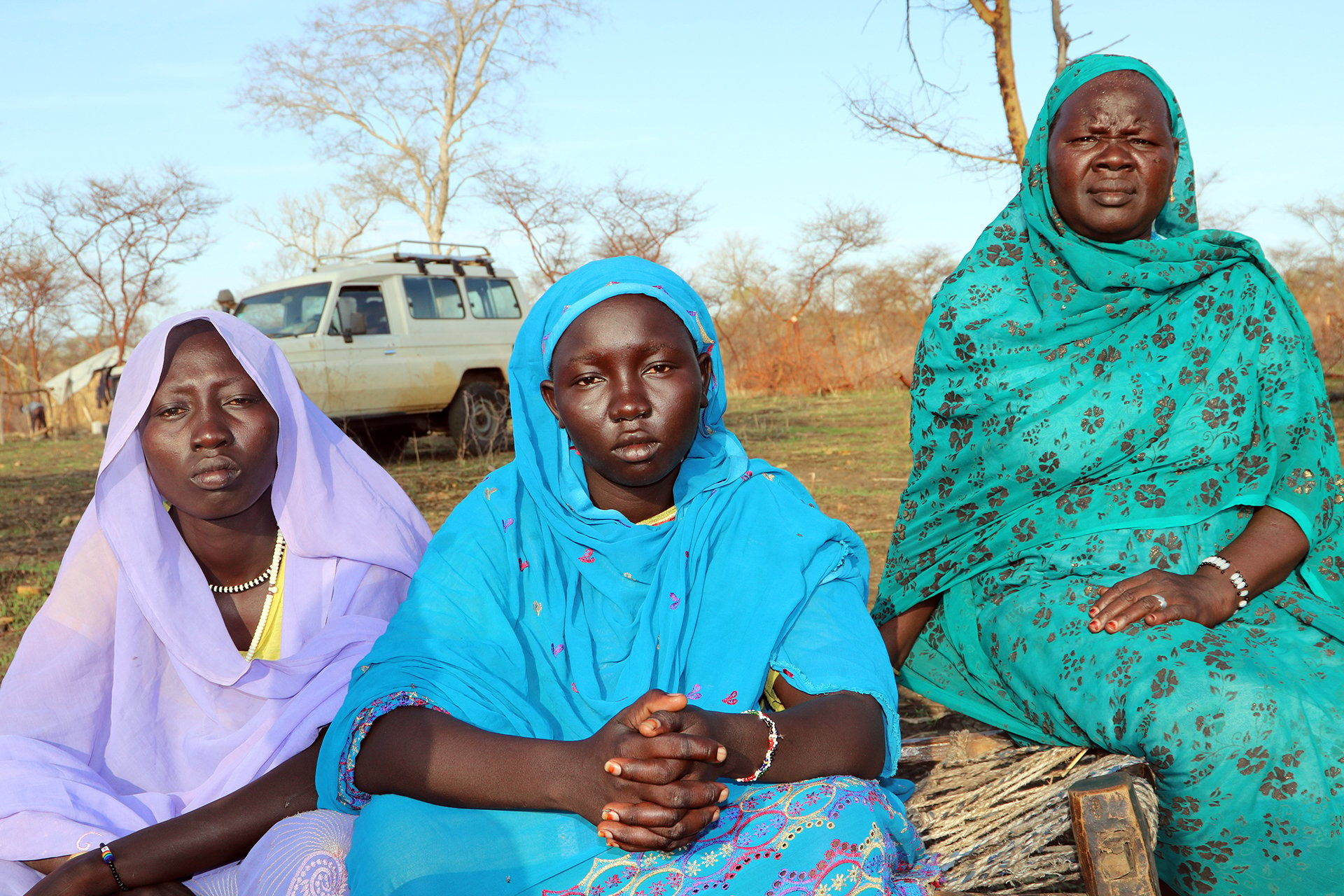 Displaced women sitting on a bed in south Ulu village in Blue Nile state.