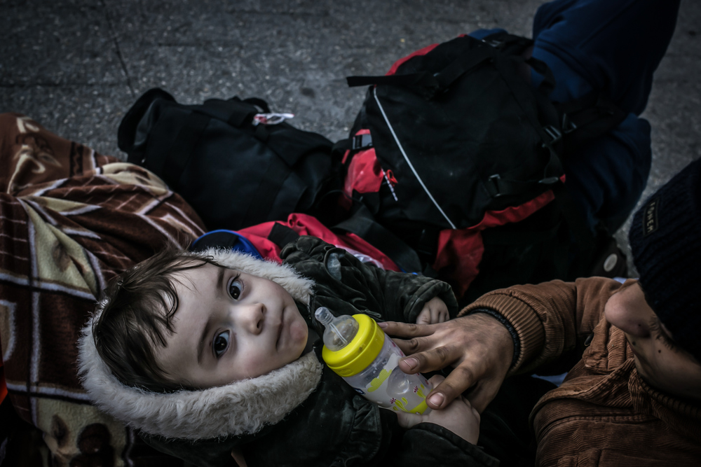 Syrian children among a group of refugees at Basmane bus station who were returned to Izmir after their boat was turned back