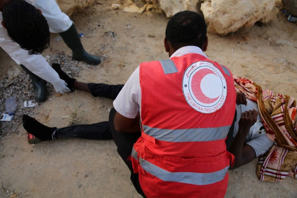 Libyan Red Crescent volunteers find another migrant body on Garibouli beach, near Tripoli, which has become increasingly used by people smugglers to launch boats