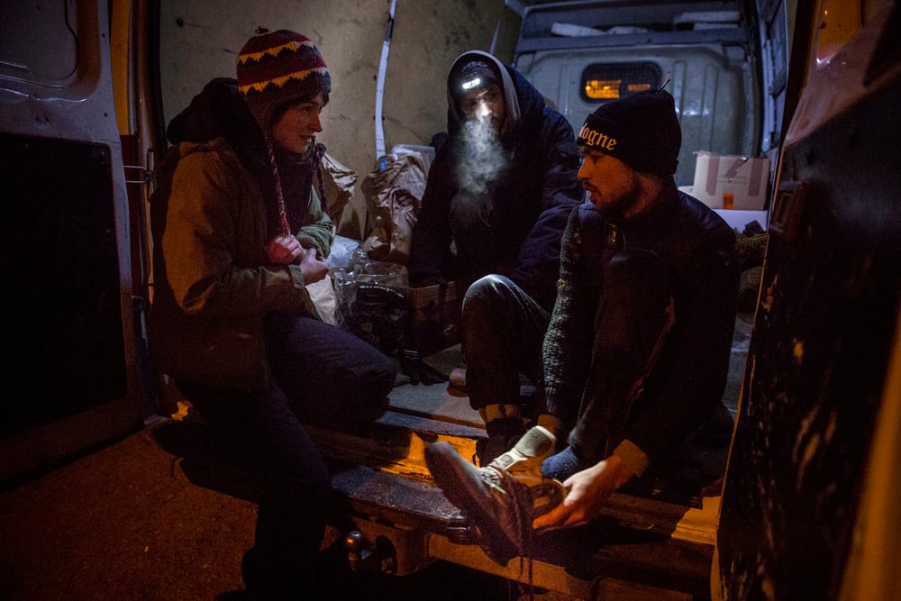 German volunteers from the organisation I'm Human provide Shafiullah Muzaffar with dry boots, socks, gloves and a hat