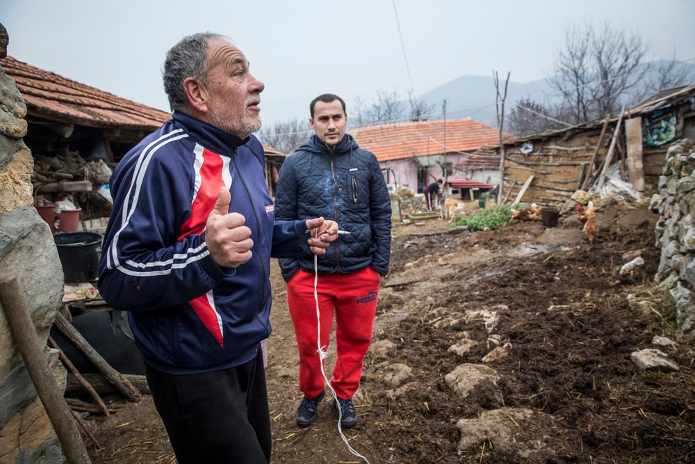 Aleksander Nackov and his father, Ljubomir, at their farmhouse in Gradina, close to the Bulgarian border where the older man says he often sees migrants passing near his home