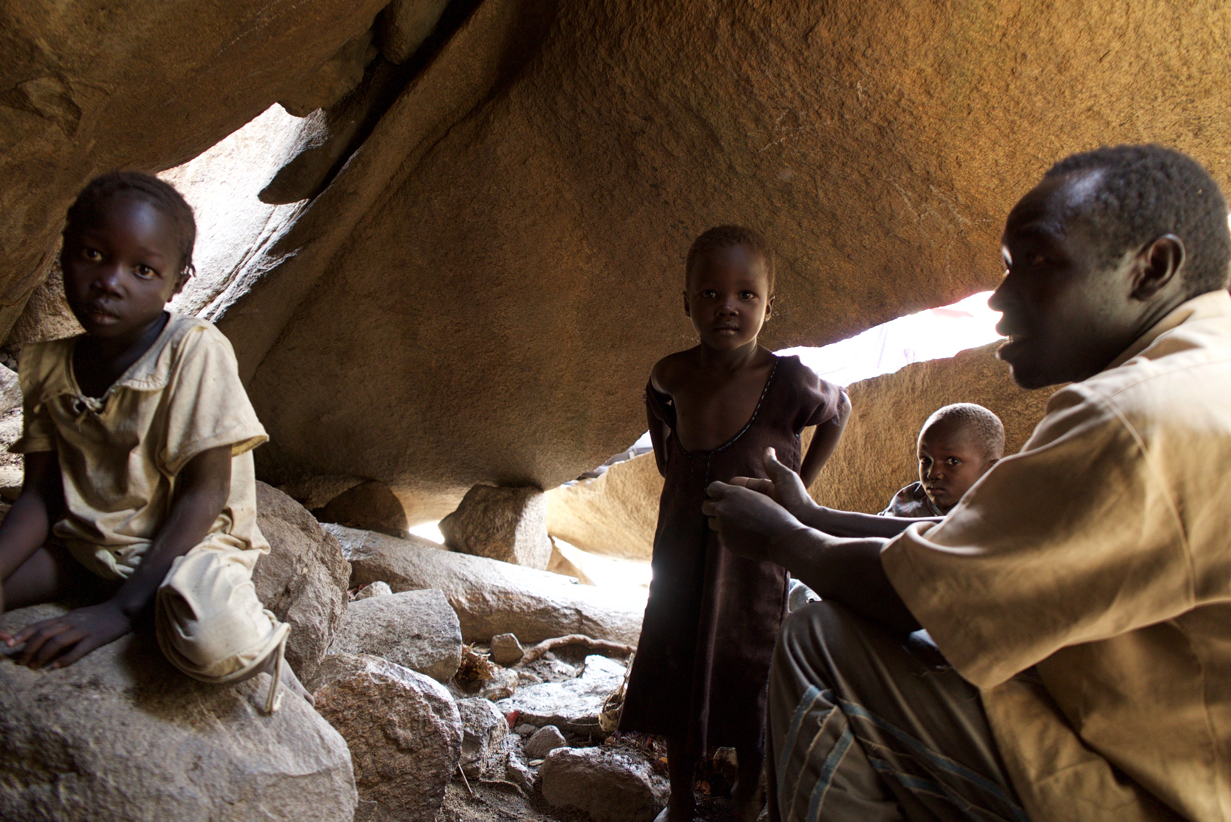 Family shelters under rocks