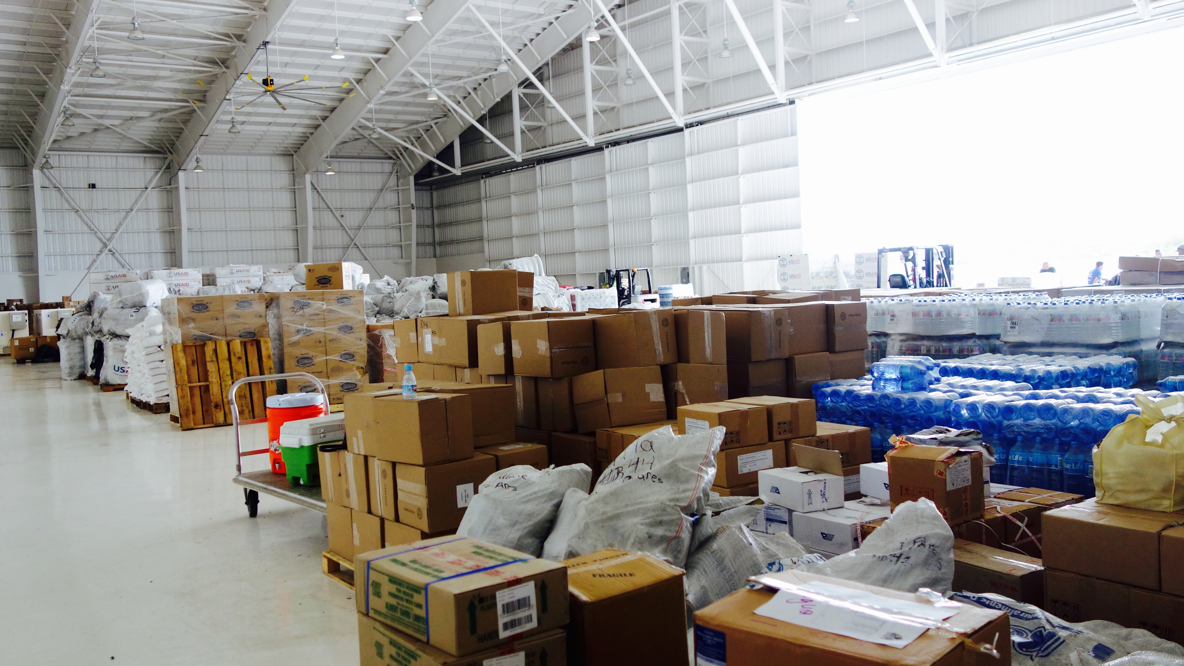 aid supplies in a warehouse in Dominica after Hurricane Irma, Jose, and Maria