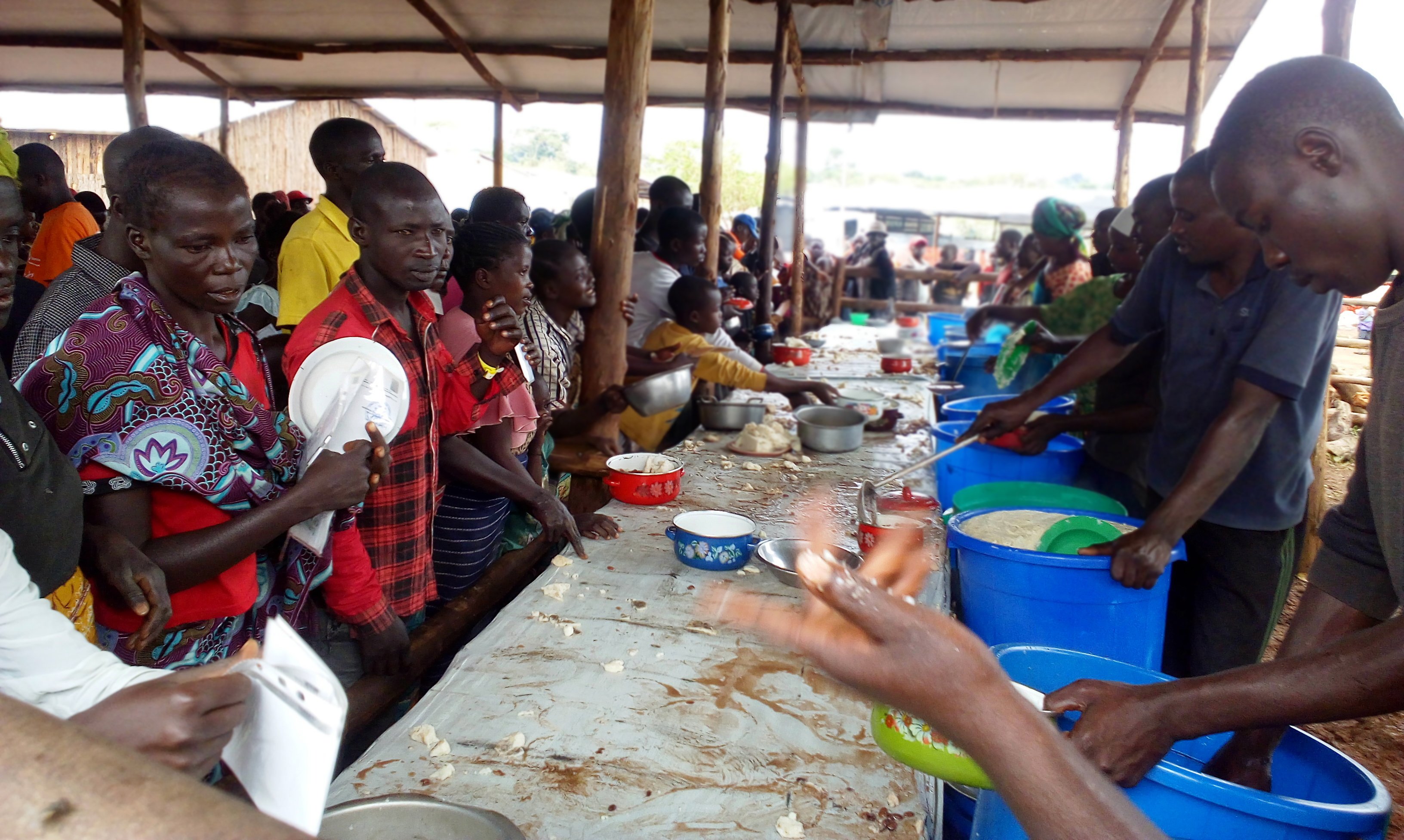 Refugees from Ituri Province get lunch at Kagoma Reception Centre, Kyangwali refuge