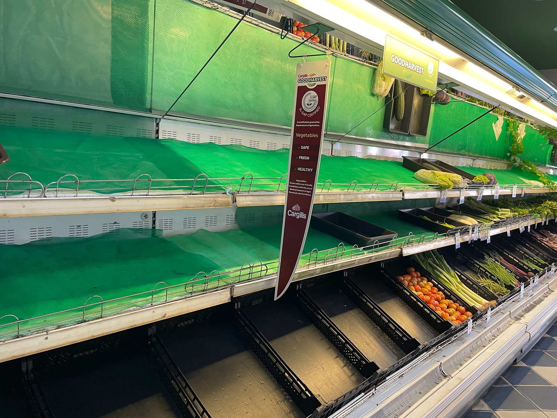 An empty supermarket shelf in Matara. Fuel shortages and soaring food prices have led to scarcity.