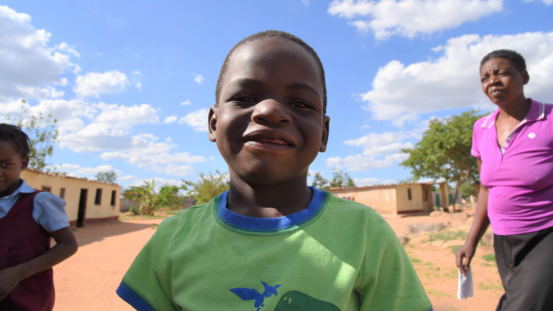 Two children and their mother in Epworth, Zimbabwe.