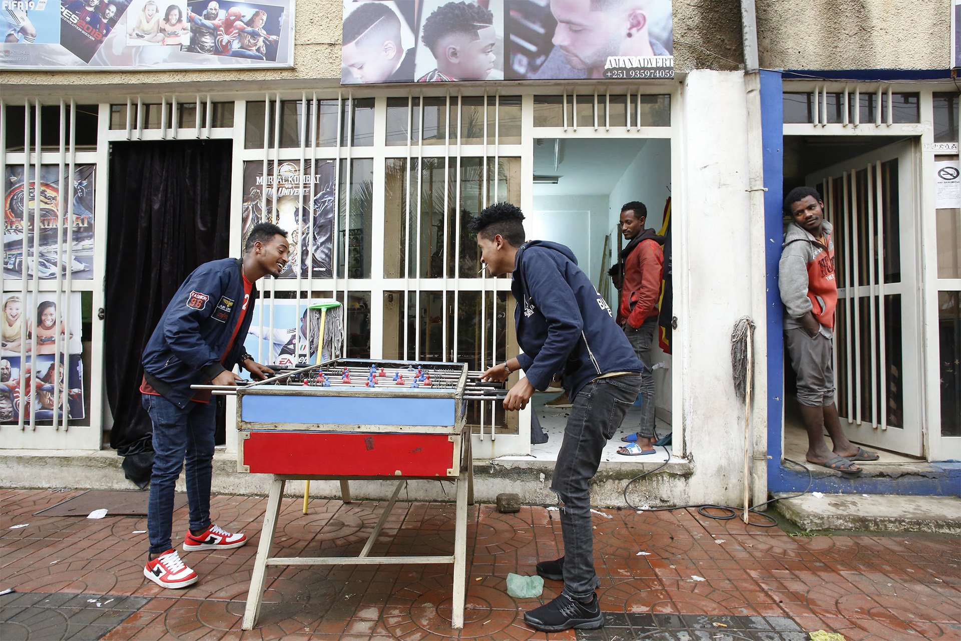 Young Eritreans while away time in the Mebrat Hail suburb of Addis Ababa.