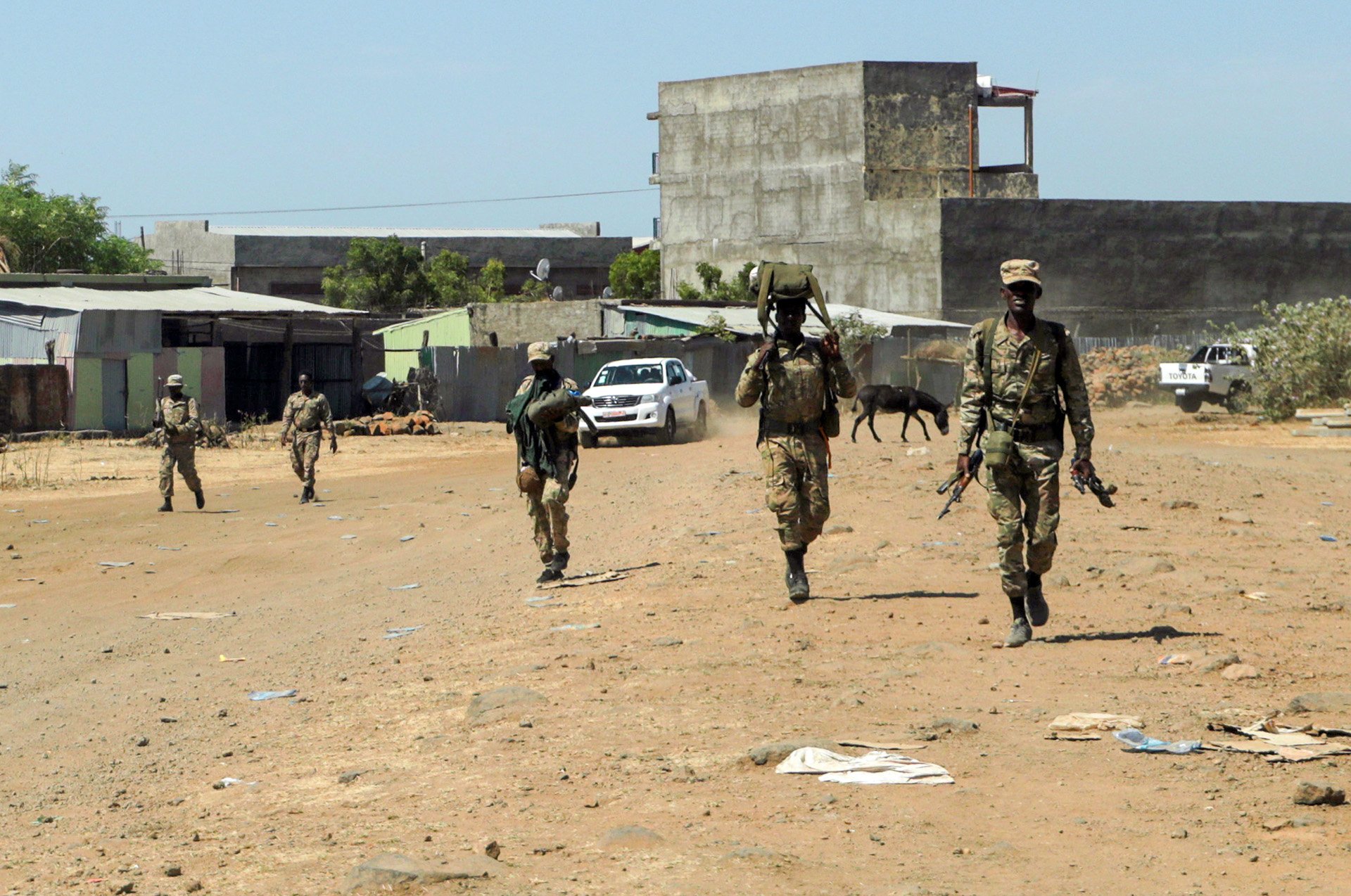 Militia fighters return to their base following clashes with the Tigray People's Liberation Front in northern Ethiopia. Analysts fear a sustained conflict in the region could spread to other parts of the country and draw in neighbouring states