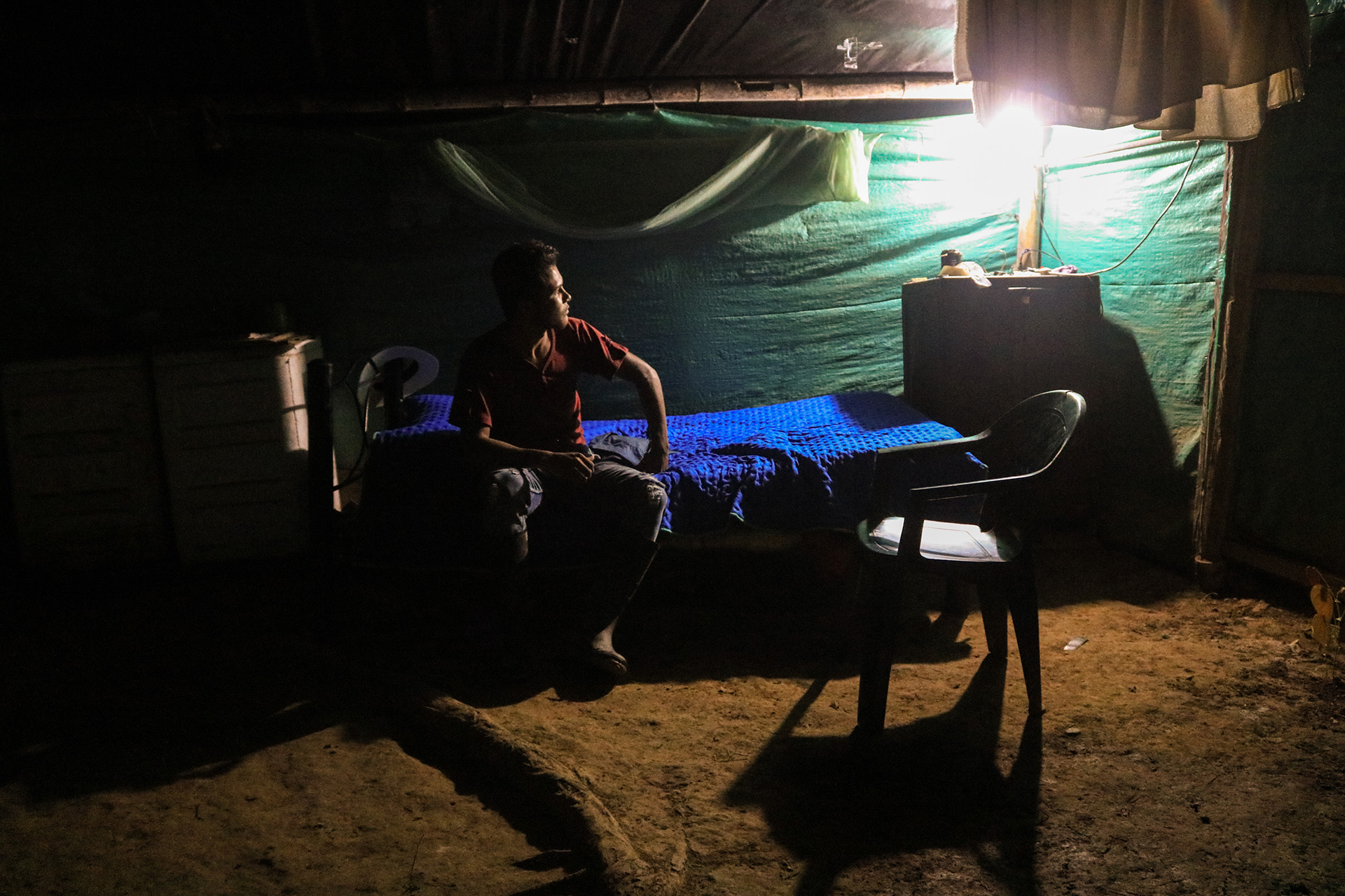 A former combatant inside his living space at the cooperative. 