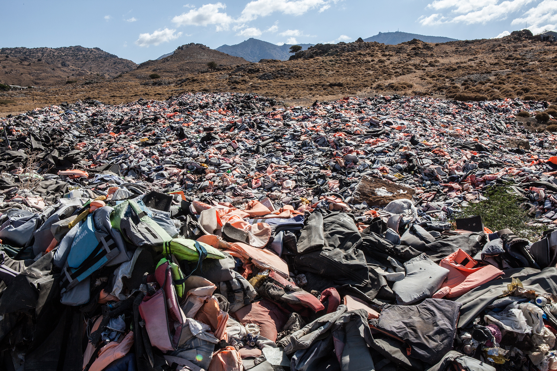 Life jackets and rubber dinghies thrown away in Lesvos.