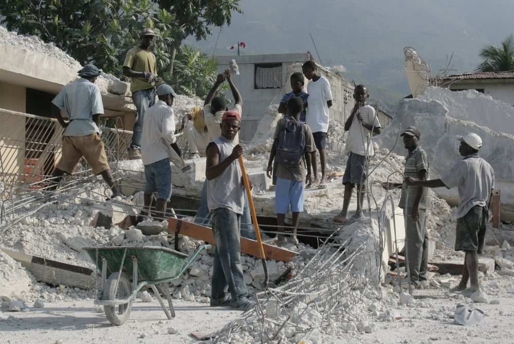 Young people cleaning up earthquake rubble