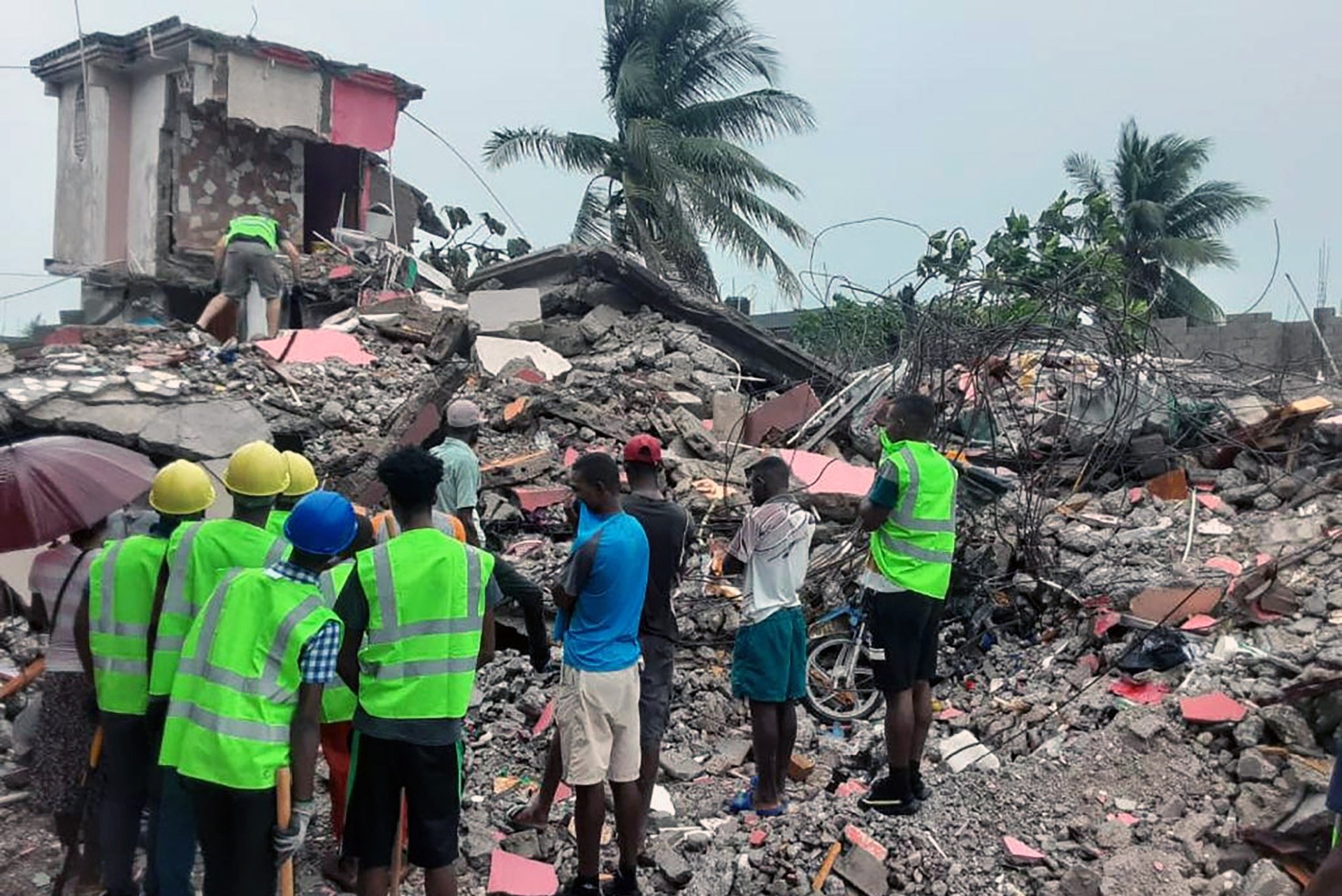 Rescuers search the rubble in Les Cayes for survivors in the aftermath of Saturday's earthquake.