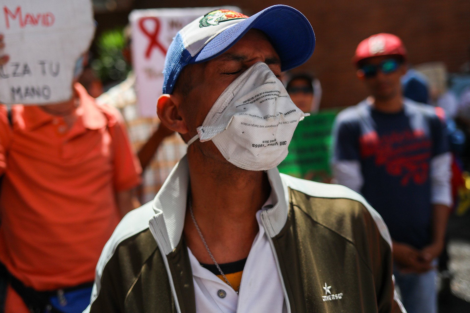 A patient demonstrates against a lack of access to retroviral drugs and the state.