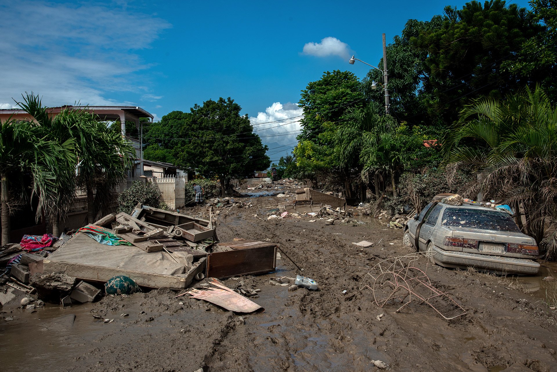 A muddy residential street in La Lima, Honduras after hurricane Iota flooded the region.