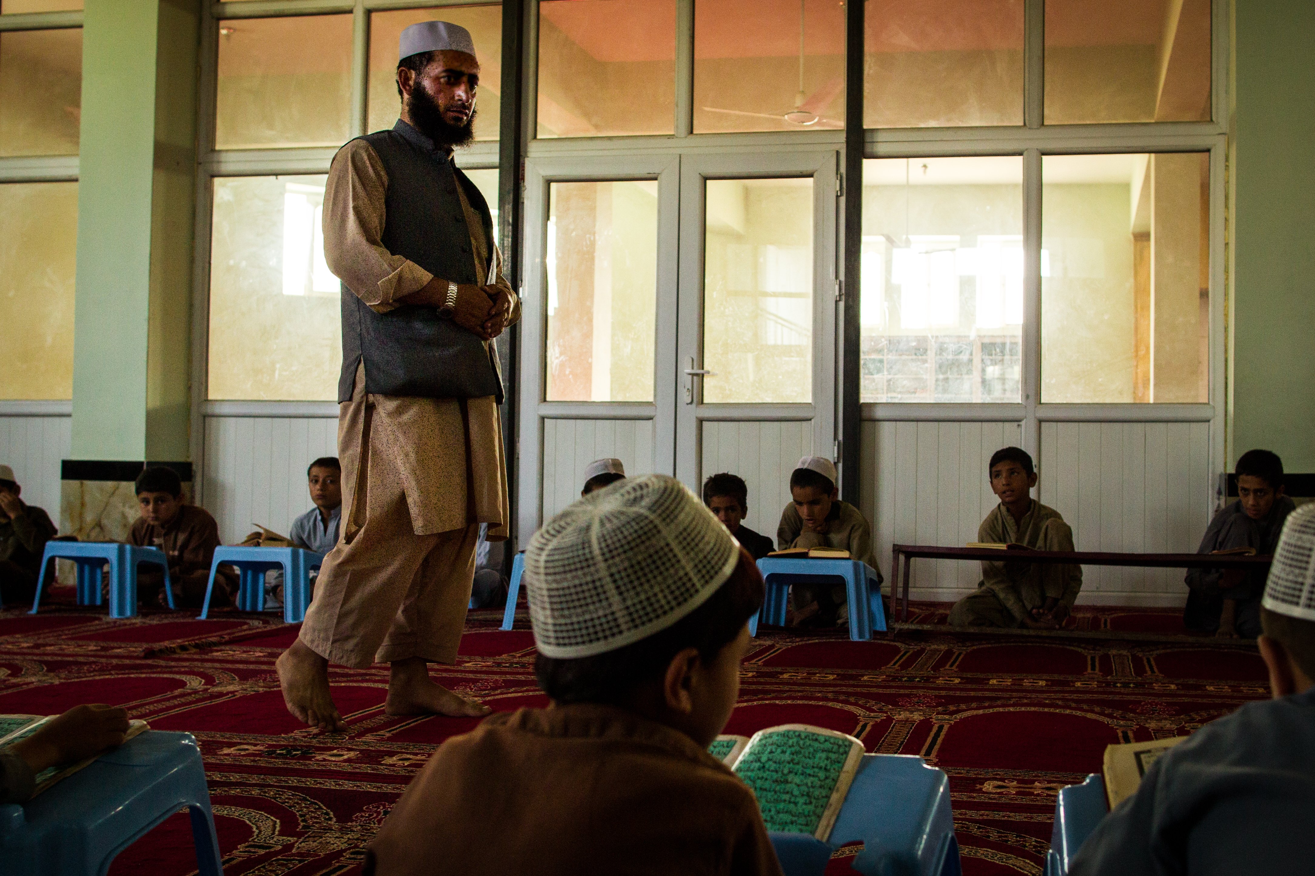 A man teaches children at a mosque in Kabul.