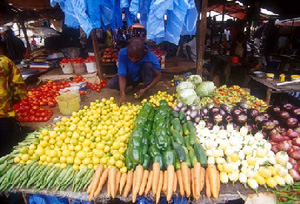 [Tanzania] Vegetable vendors in Dar es Salaam, part of the informal economy that the country relies on, but remains largely unrecognised, 18 September 2003.