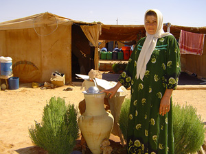 [Jordan] Iranian Kurdish refugee, Jalila shows her small vegetable patch at the camp in no-man's-land.