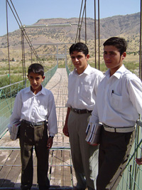 [Iraq] Banale children on the bridge, built with help from REACH, on their way to secondary school in Barsmaq. The walk takes an hour.