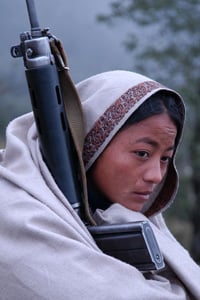 An innocent girl holding brass Kalaha and kneeling over one knee - Photos  Nepal