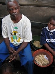 [Nigeria] Martins Oke, lives and fishes in Makoko, a slum of houses on stilts in central Lagos, Nigeria. Here making tools to mend his fishing nets, Oke makes a living as a fisherman in the filthy waters of the Lagos Lagoon. [Date picture taken: 08/23/200