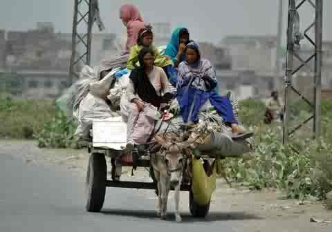 Bisma, Uzma, Asia and Deeba, all sisters, take a ride on a cart, Lahore, Pakistan, 6 March 2007. Their eldest sister Kuslom was murdered in an apparent honor killing two years ago. Their uncle and father remain on the run and are accused of committing the