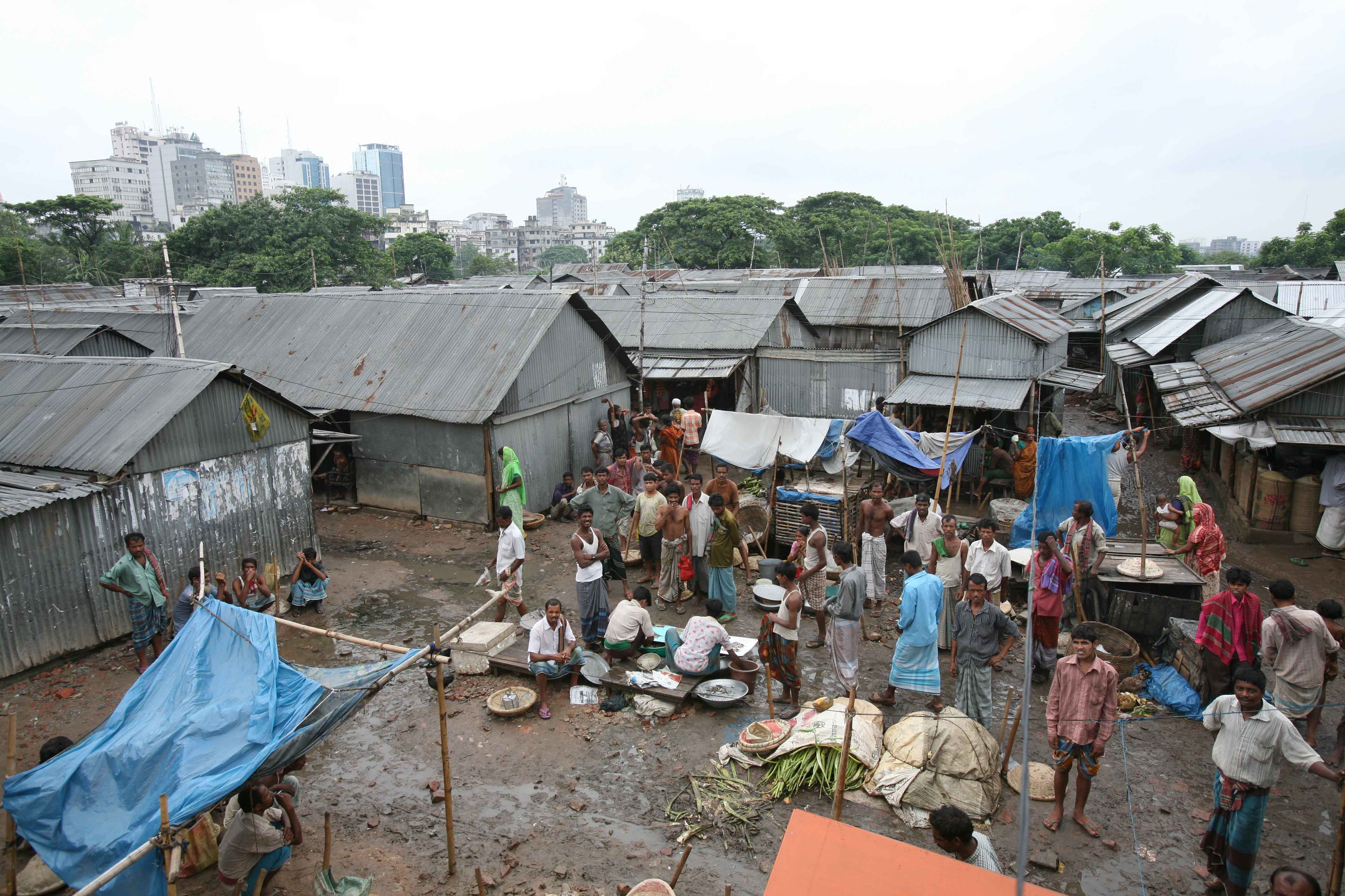 Traders sell their wares in the Dhaka slums, Bangladesh, July 2007 ...