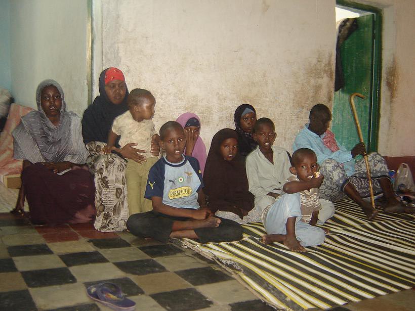 Zahra Abdille(in red scarf) sits with her children, Somalia, September 2007.