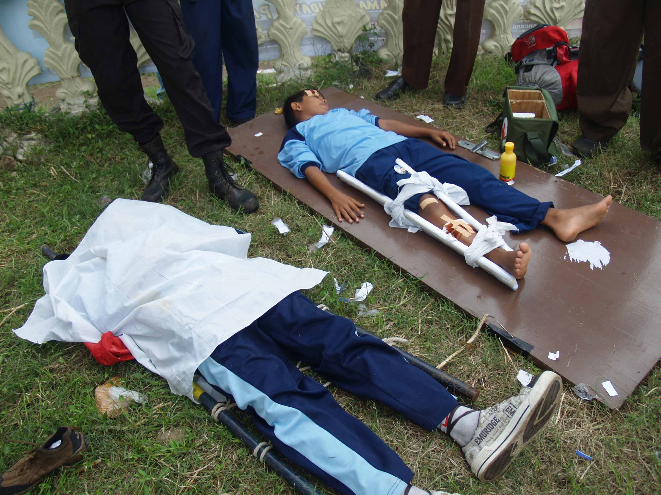 Practicing for the real thing: Students at the National Exhibition of Disaster Preparedness in Padang participate in a disaster drill in which they recover the dead and treat the injured.