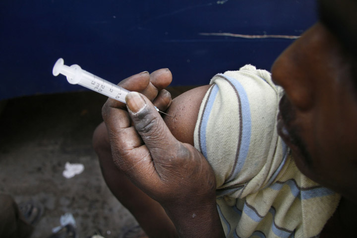 Drug-users on the roadside in Dhaka, capital of Bangladesh, February 2008. Some NGOs are distributing new syringes but many addicts still share with other users, heightening the risk of disease.