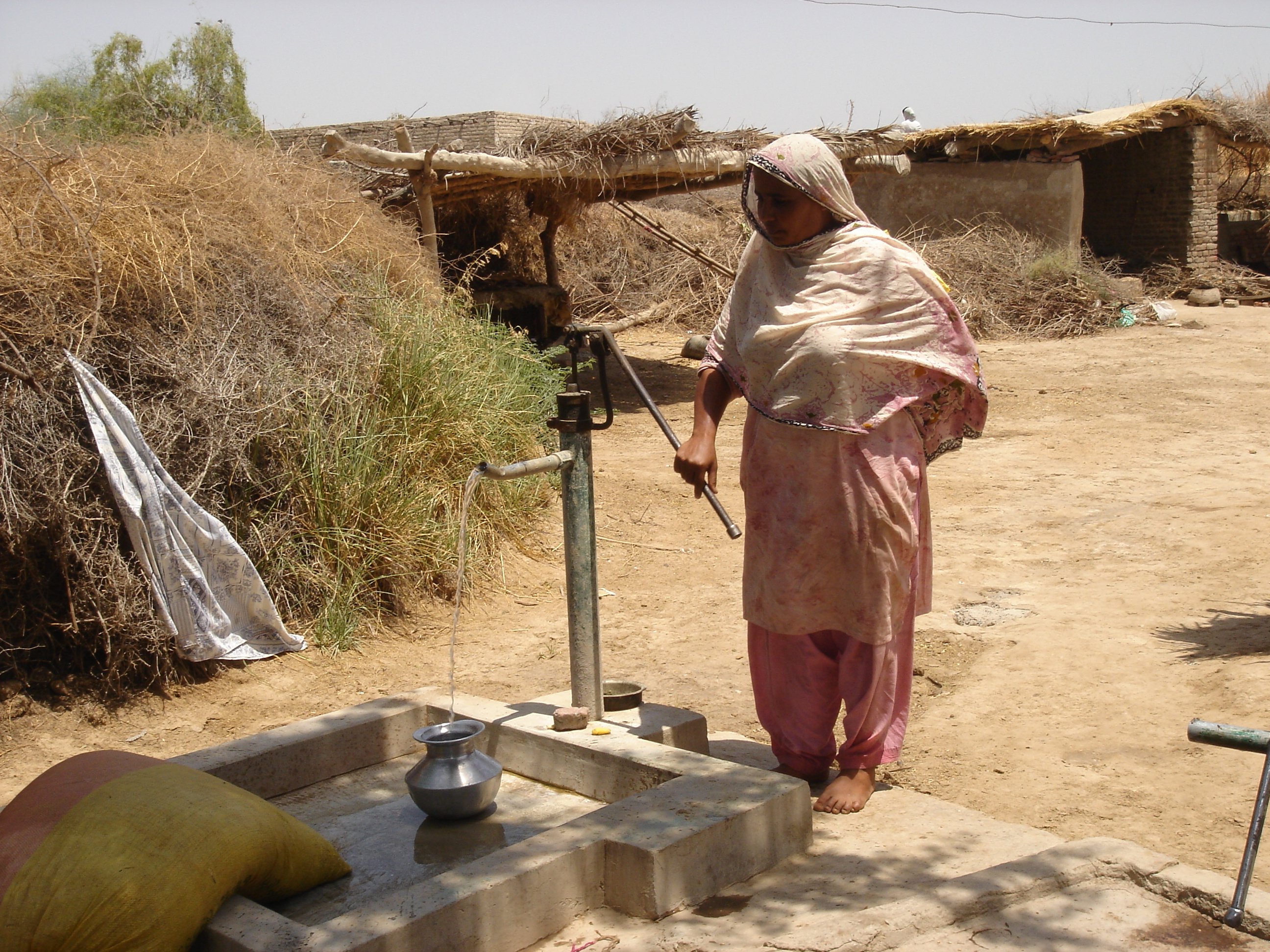 A woman fetches water from a hand pump in Pakistan's southern Sindh province.