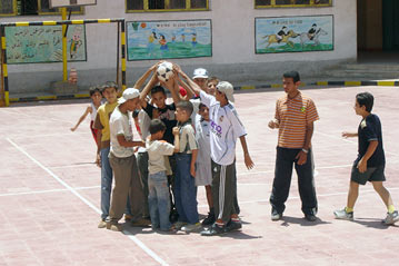 Refugee children play at a school in 6th of October City near Cairo. Doctors say Iraqi refugee children have health problems unique to their population.