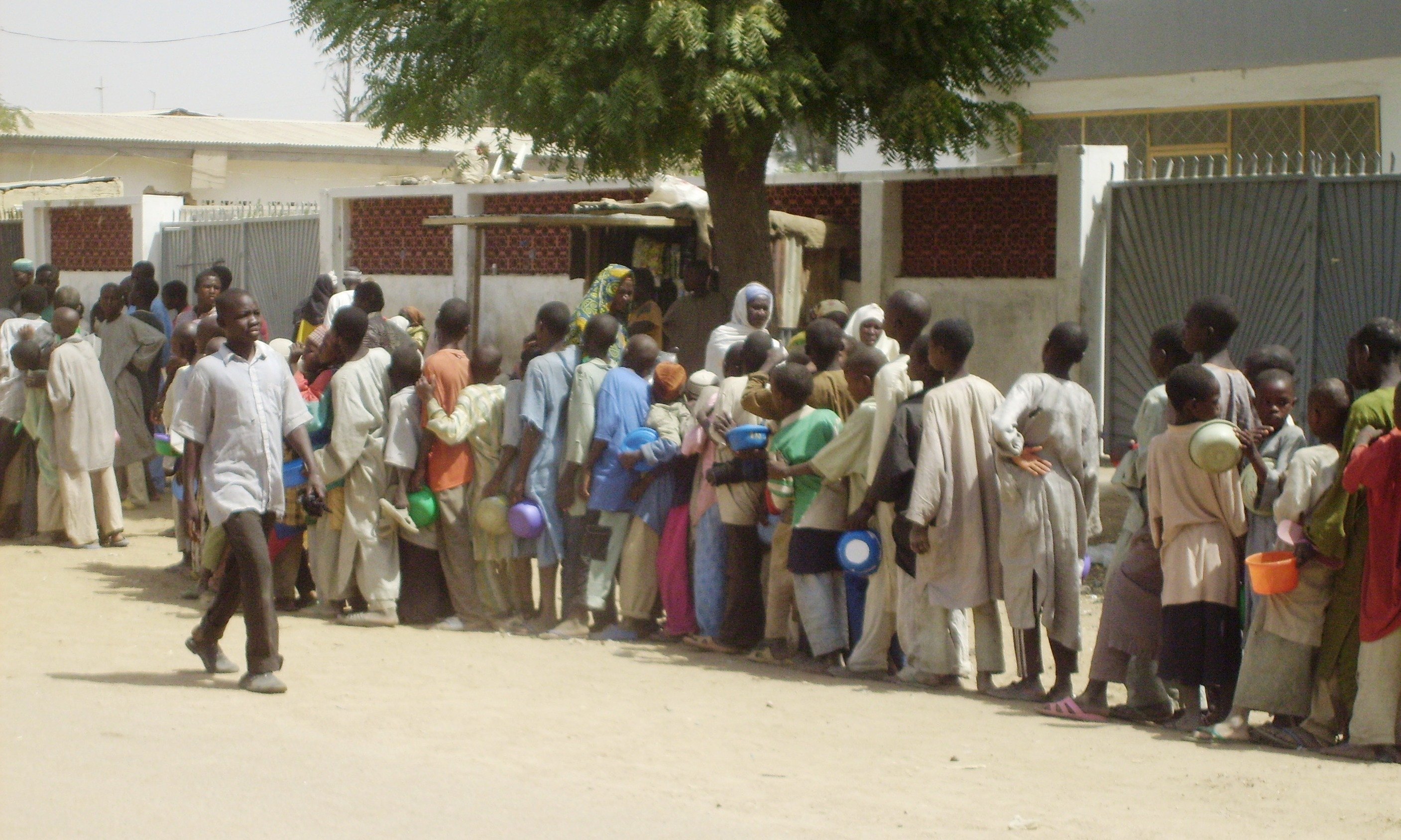 Child beggars queue for food in Kano.