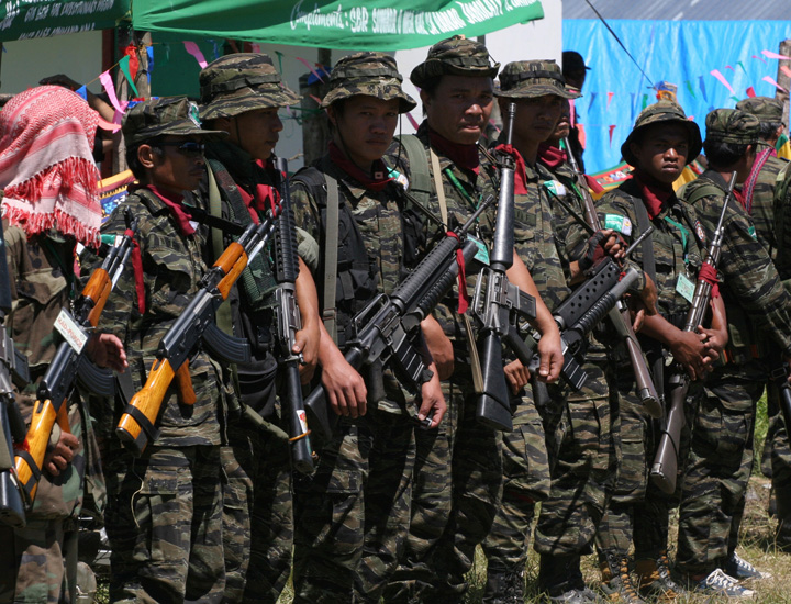 Moro Islamic Liberation Front (MILF) guerrillas during a gathering in the group's Camp Bushra, Mindanao island, Philippines March 2008.
The Philippine government's 35-year confrontation with Muslim separatists and a second conflict with communist insurge