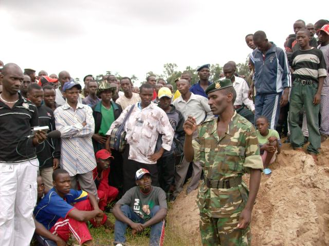 Officer in charge of public relations at the Demobilisation Body giving instructions to the demobilised.
