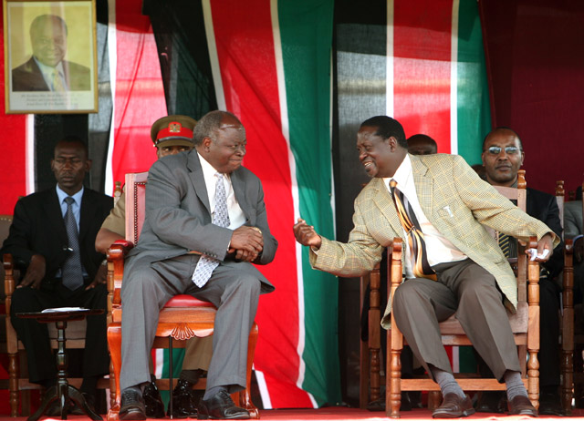 The Kenyan president and the prime Minister share a light moment during their trip to rift valley to aid in the resettlement of the IDPs in the post election crisis, Eldoret, Kenya 2008.