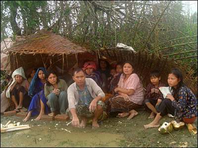 Survivors take shelter while waiting for first aid treatment in the town of Labutta, one of Cyclone Nargis' worst-hit areas, 120km southwest of Yangon.