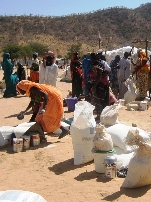 Displaced women at Koloma in southeastern Chad gathering to receive food aid for their families.
