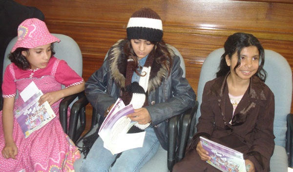 Three married young girls (aged eight, 12 and 10) during a public discussion by civil society organisations on child marriage.