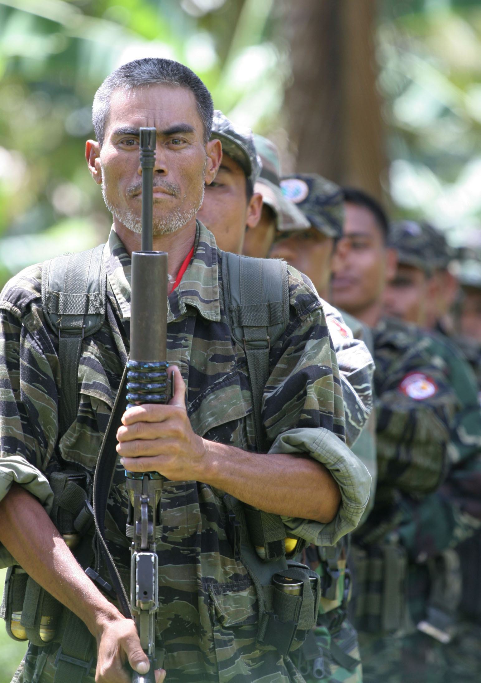 MILF rebels do military drills at a rebel camp in Mindanao. With ...