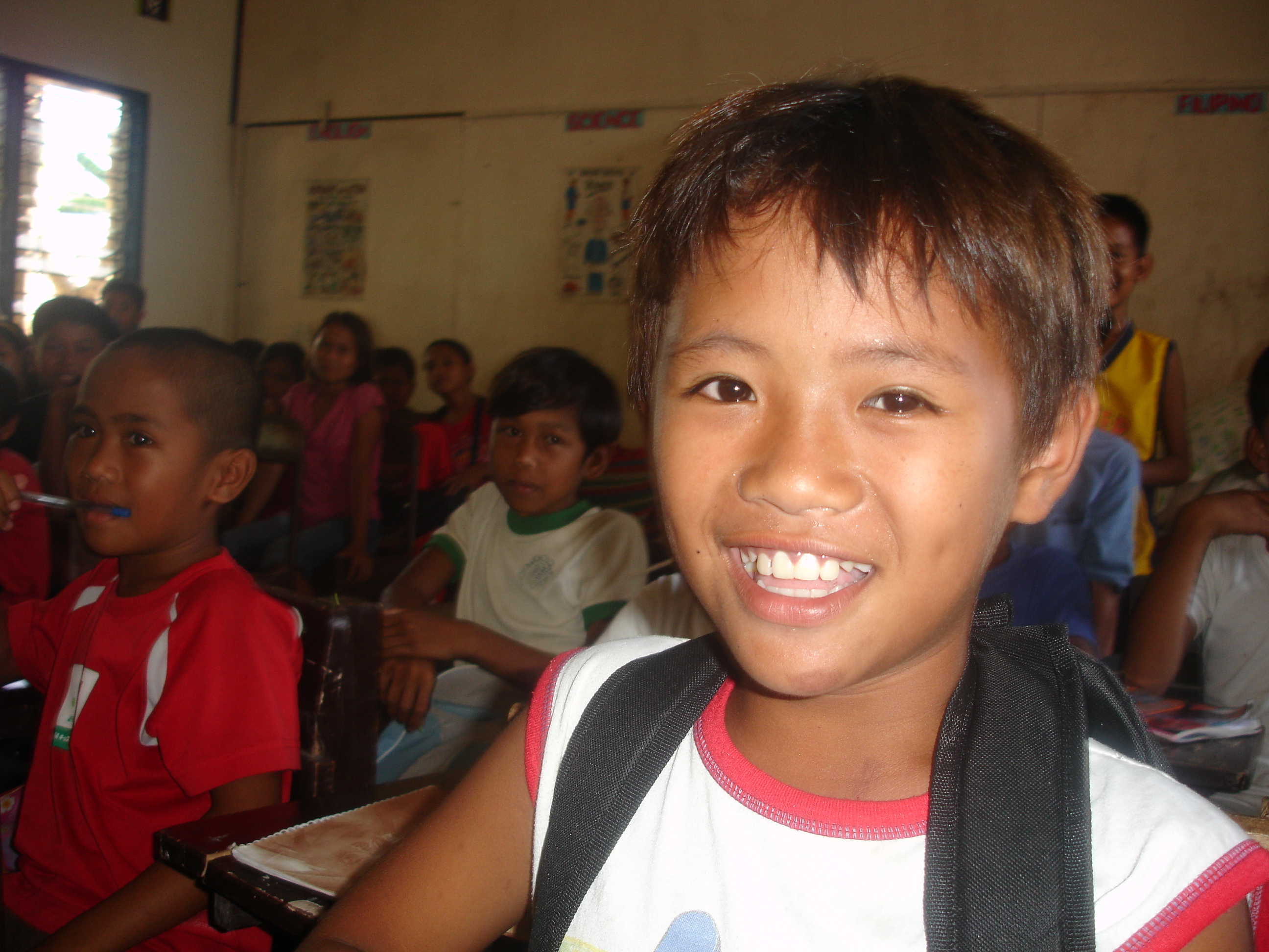 A young schoolboy at the Sambulawan elementary school in Mindanao. Thousands of children are not attending school regularly as a result of the conflict which reignited in August 2008.