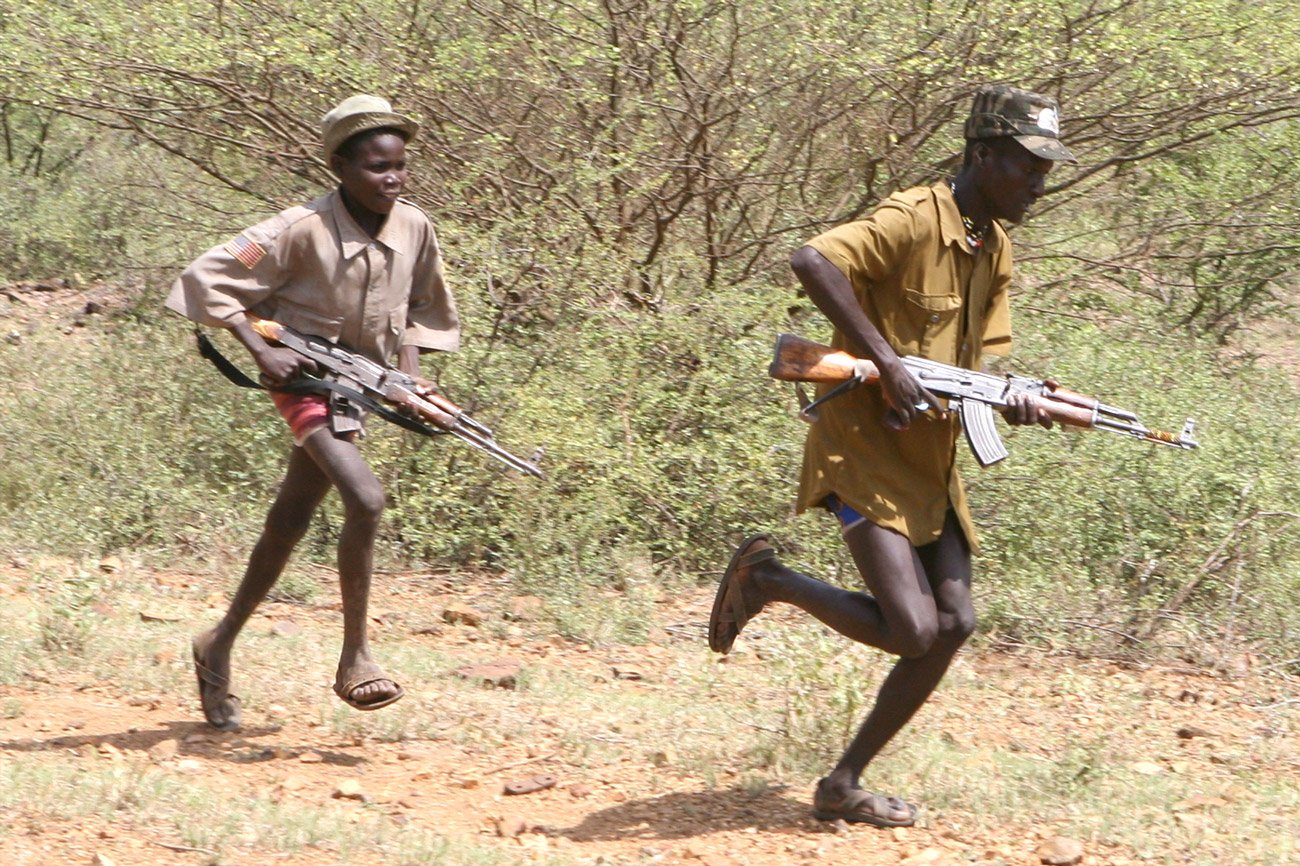 Turkana youths in northern Kenya, near the Sudanese border. Small arms such as the AK-47 are widespread among pastoralist communities in east Africa, where increasingly severe and unpredictable drought has contributed to an increase in conflict between di